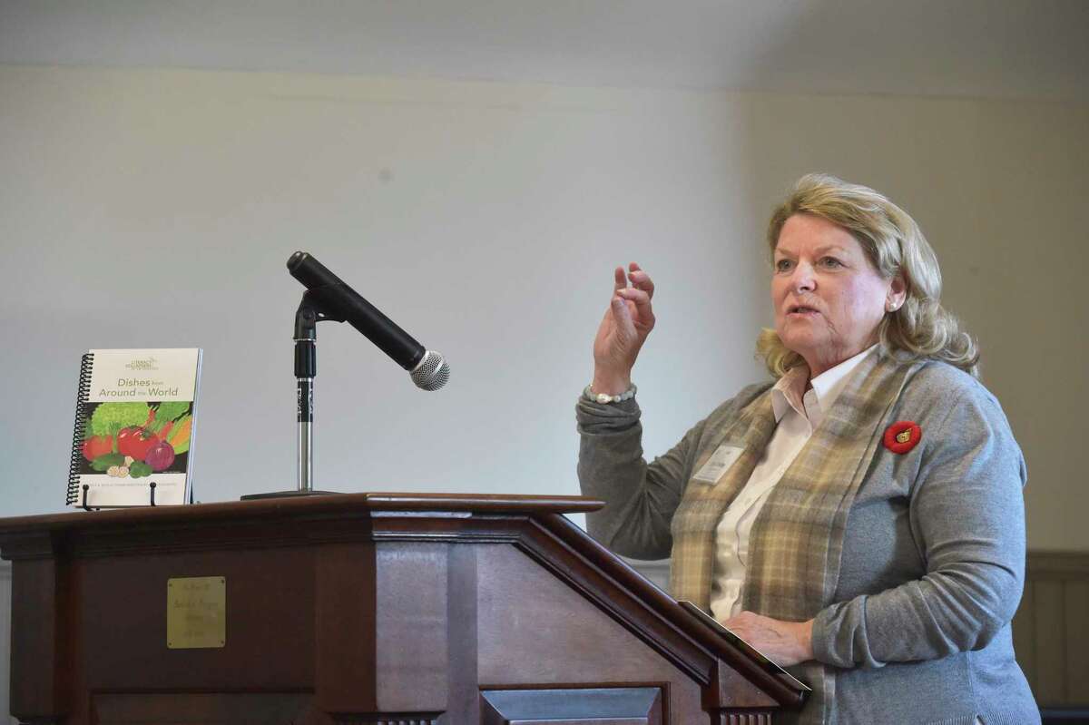 Lynn Davies, executive director of Literacy Volunteers on the Green, speaks at a book launch by the group at the New Milford Public Library on Thursday November 9, 2023, in New Milford, Conn. It was for a book of recipes and reflections written by the group's ESL students. 