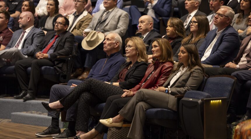 a photo of people sitting inside Rudder Theatre during Interim President Mark A. Welsh III's State of the University address.