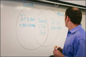 Sargy Letuchy draws an illustration he uses to show other teachers how to teach their students writing that is aligned with the common core.