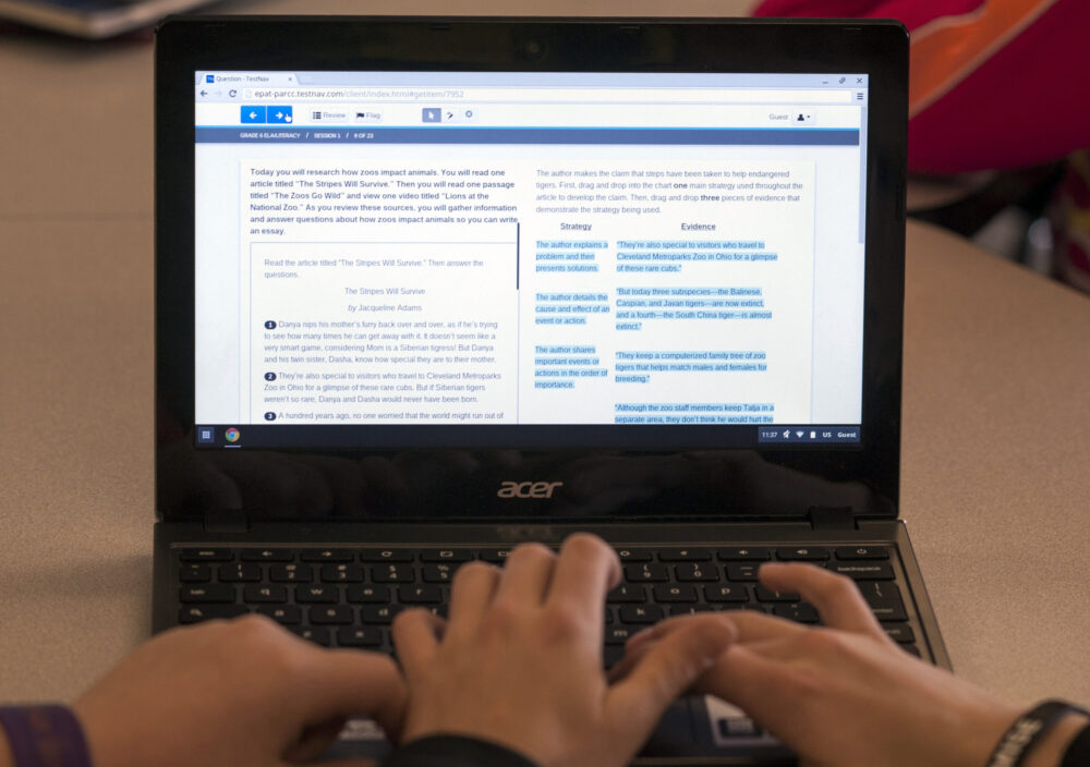 FILE - In this Feb. 12, 2015, file photo, sixth grade students use a practice session to prepare for the the Common Core State Standards Test at Morgan Elementary School South in Stockport, Ohio. Republican presidential candidates are taking aim at Common Core, criticizing the academic standards as an overreach of the federal government. But Common Core was created by the states. And while the Obama administration had given states incentives to adopt those standards, a new federal education law bars Washington from continuing to do so.