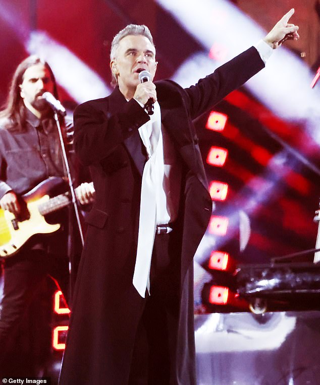 93397257-14219763-It_comes_after_Robbie_s_hopes_of_scoring_his_first_Academy_Award-m-146_1734907392188.jpg